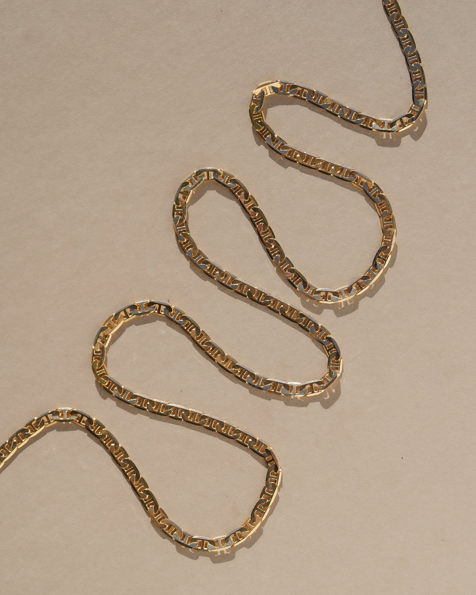 A simple braided chain intended to provide a ring of protection and luck when worn. 18k gold filled chain. Handmade in the Santa Cruz Mountains.