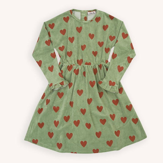 Green velvet long sleeved dress with a red heart print made with 95% organic cotton. Ethically produced, colorful and fun with an eye towards comfort, style and joy. Modern and sustainable kids clothing by CarlijnQ of the Netherlands.