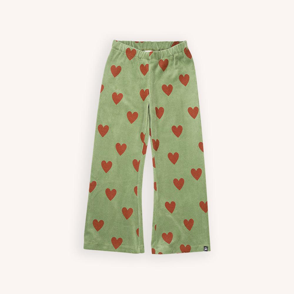 Green velvet flared leggings with a red heart print made with 95% organic cotton. Ethically produced, colorful and fun with an eye towards comfort, style and joy. Modern and sustainable kids clothing by CarlijnQ of the Netherlands.