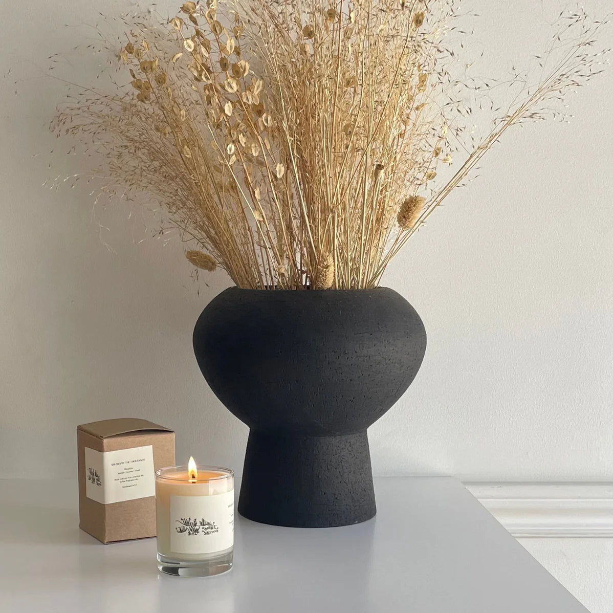 species by the thousands meadow candle / This hand poured candle expresses the wild floral wonder of untamed rolling meadows, with a blend of jasmine, incense & wood