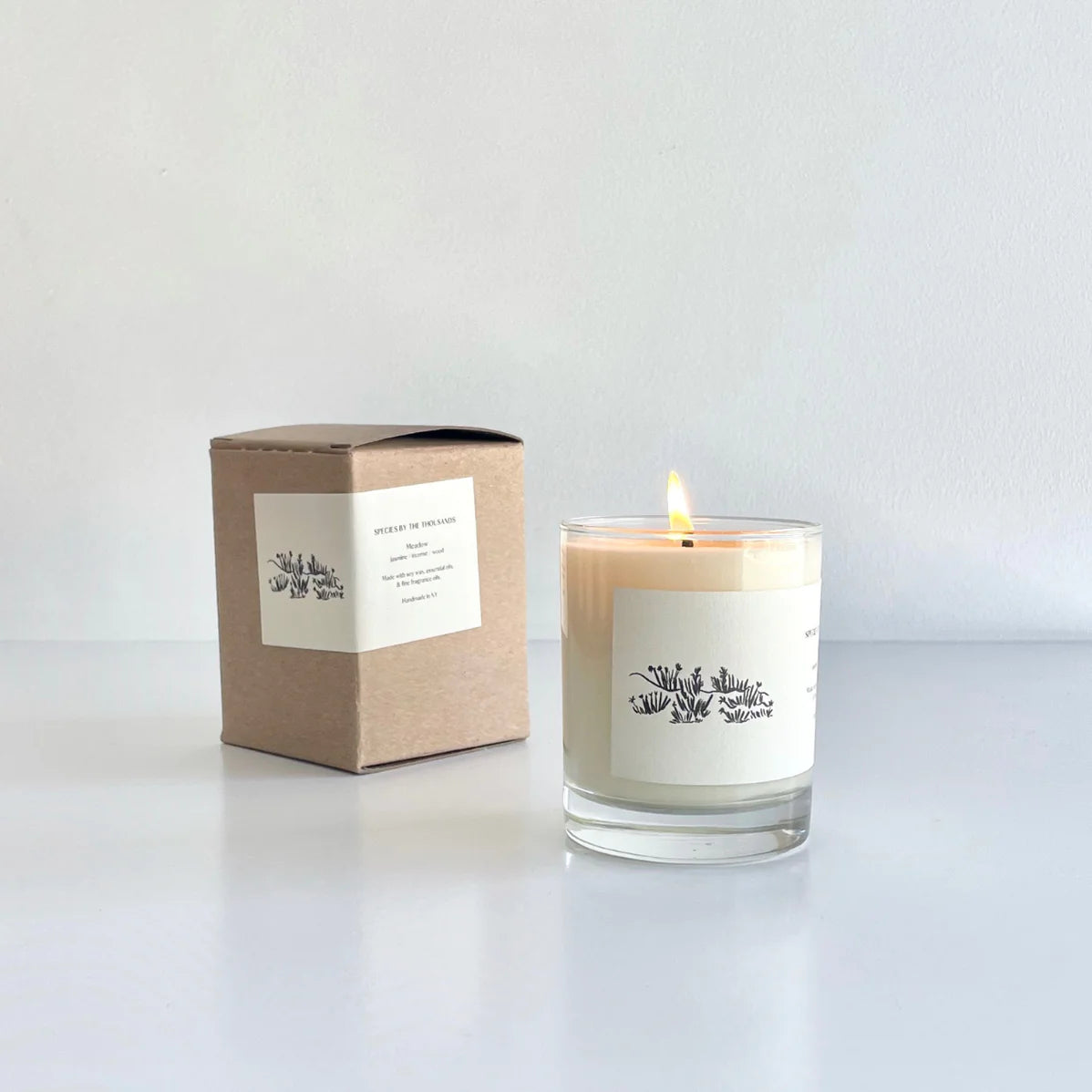 species by the thousands meadow candle / This hand poured candle expresses the wild floral wonder of untamed rolling meadows, with a blend of jasmine, incense & wood