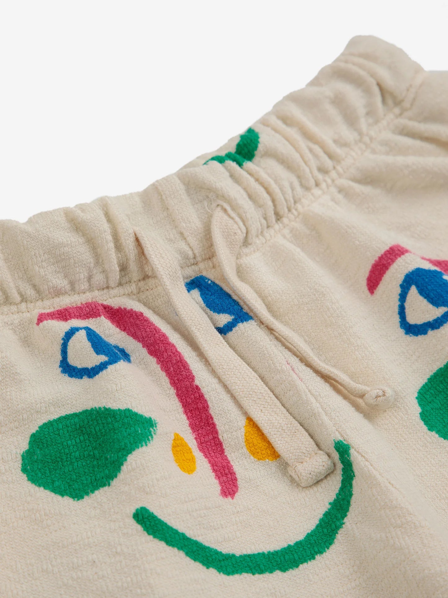 Smiling Mask All Over Jogging Pants by Bobo Choses.