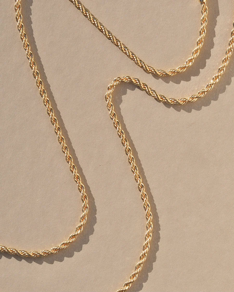 The Quipu necklace features a twisted braided effect inspired by ancient weaving techniques. Handmade in the Santa Cruz Mountains.