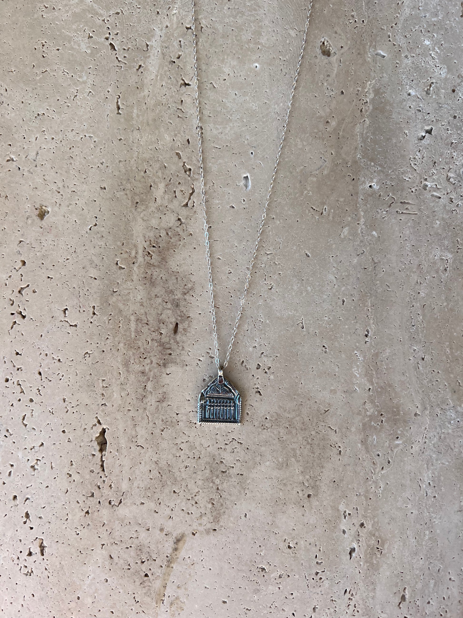 Delicate light weight hand carved charm necklace designed to represent a door, passageway or opportunity. Recycled brass pendant coated in a thick layer of high grade 14k gold or sterling silver. Handmade in the Santa Cruz Mountains.