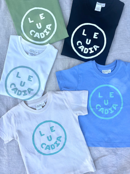A fun little organic kids tee with a super cute little Leucadia smiley face by local artist Zach Smith. Printed on an organic cotton, fair trade tee with all proceeds to San Diego area families facing housing insecurity. Keep it funky, keep it kind, keep it local.