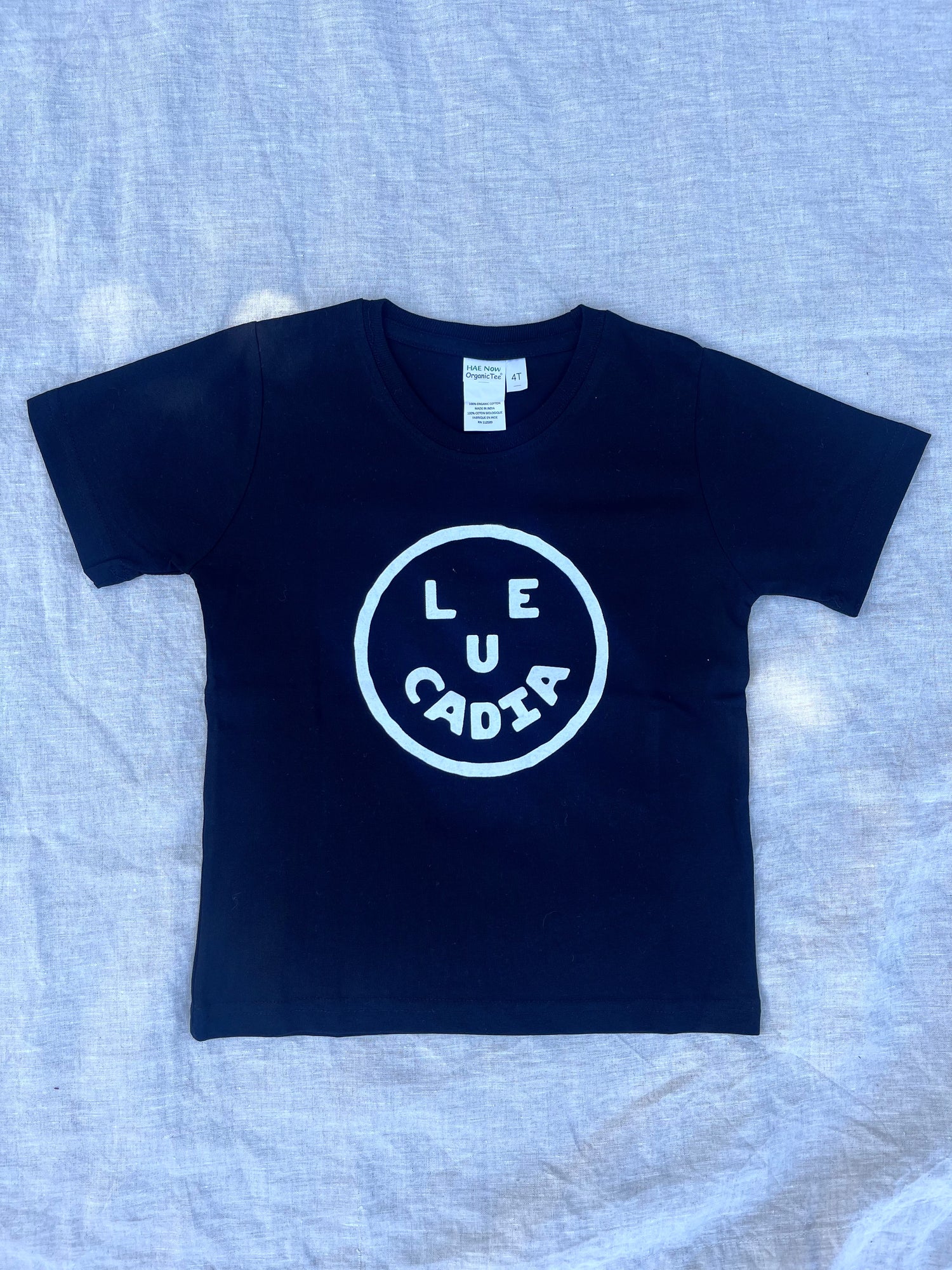A fun little organic kids tee with a super cute little Leucadia smiley face by local artist Zach Smith. Printed on an organic cotton, fair trade tee with all proceeds to San Diego area families facing housing insecurity. Keep it funky, keep it kind, keep it local.