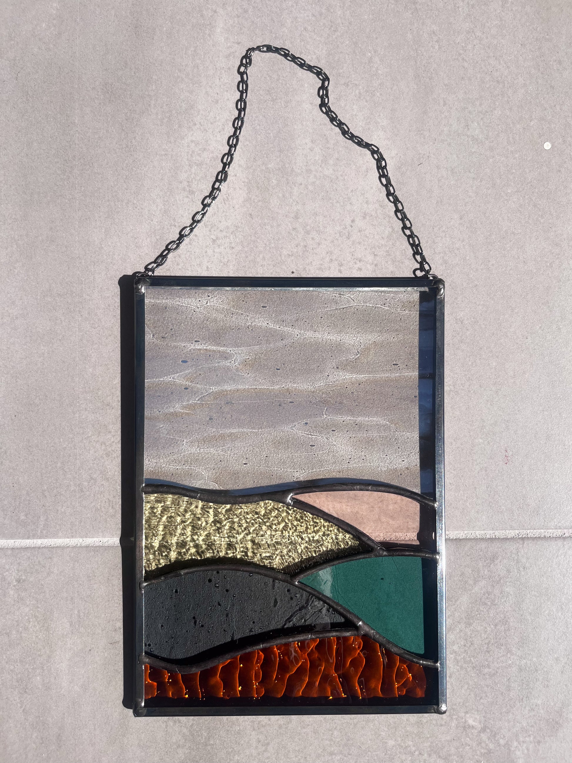 Handmade stained glass pendant with three elements attached by a silver chain. You can hang this panel in a window, on the wall as decor or even an outside patio. Custom made for Thread Spun by Culotta Creations.