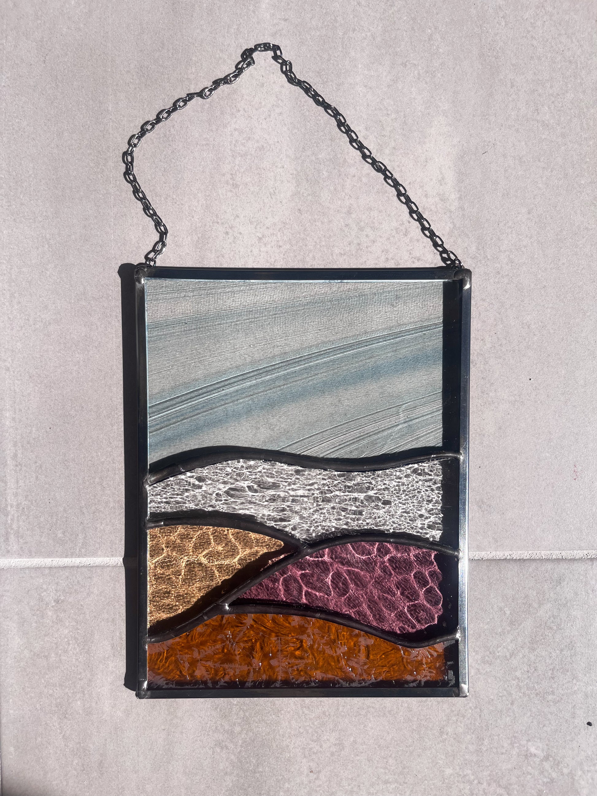 Handmade stained glass pendant with three elements attached by a silver chain. You can hang this panel in a window, on the wall as decor or even an outside patio. Custom made for Thread Spun by Culotta Creations.