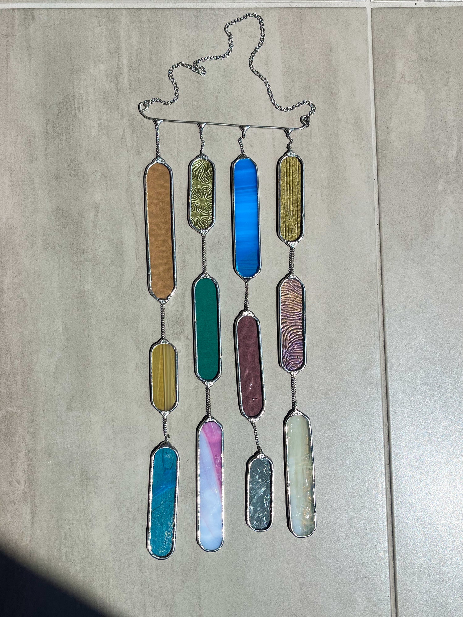 Handmade stained glass pendant with three elements attached by a silver chain. You can hang this panel in a window, on the wall as decor or even an outside patio. Custom made for Thread Spun by Culotta Creations.