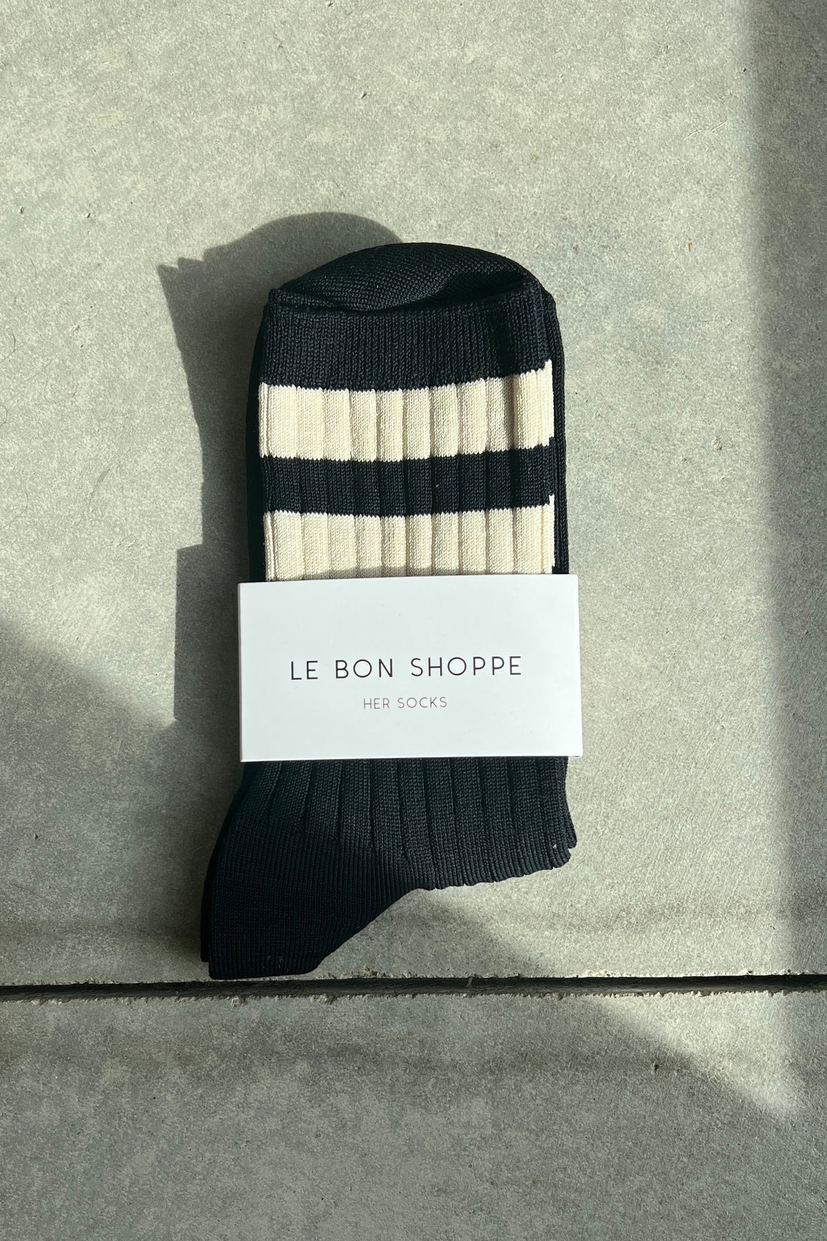 Her Varsity Socks is a varsity striped version of Le Bon's OG Her Socks which are classically ribbed, perfect height, cotton blend durable, chic go to socks. Add an understated sporty touch to any look with this bold stripe contrast version of Her Socks.