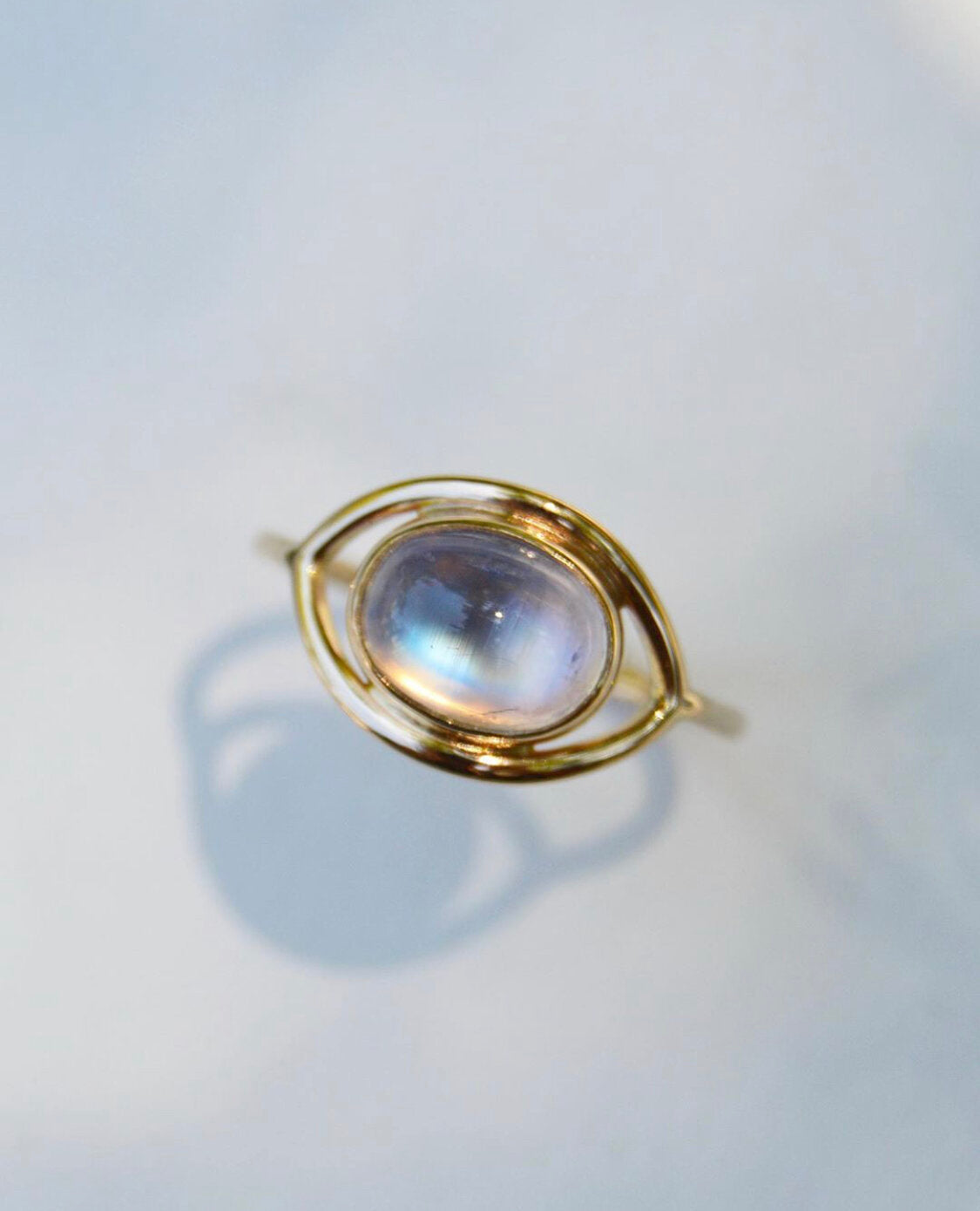 Made by hand in Northern New Mexico using recycled metals and responsibly sourced stones, this timeless, heirloom piece is sure to make a statement. This ring features a 14kt yellow gold 1.5 mm band with a moonstone cabochon.