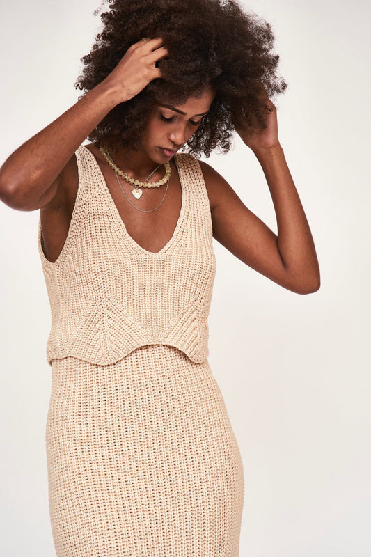 Mirth Caftans Arles Knit Tank Top. A chunky knit tank with a cropped, scalloped hem that will add the perfect amount of texture to any outfit. Ethically made with 100% cotton in Peru.