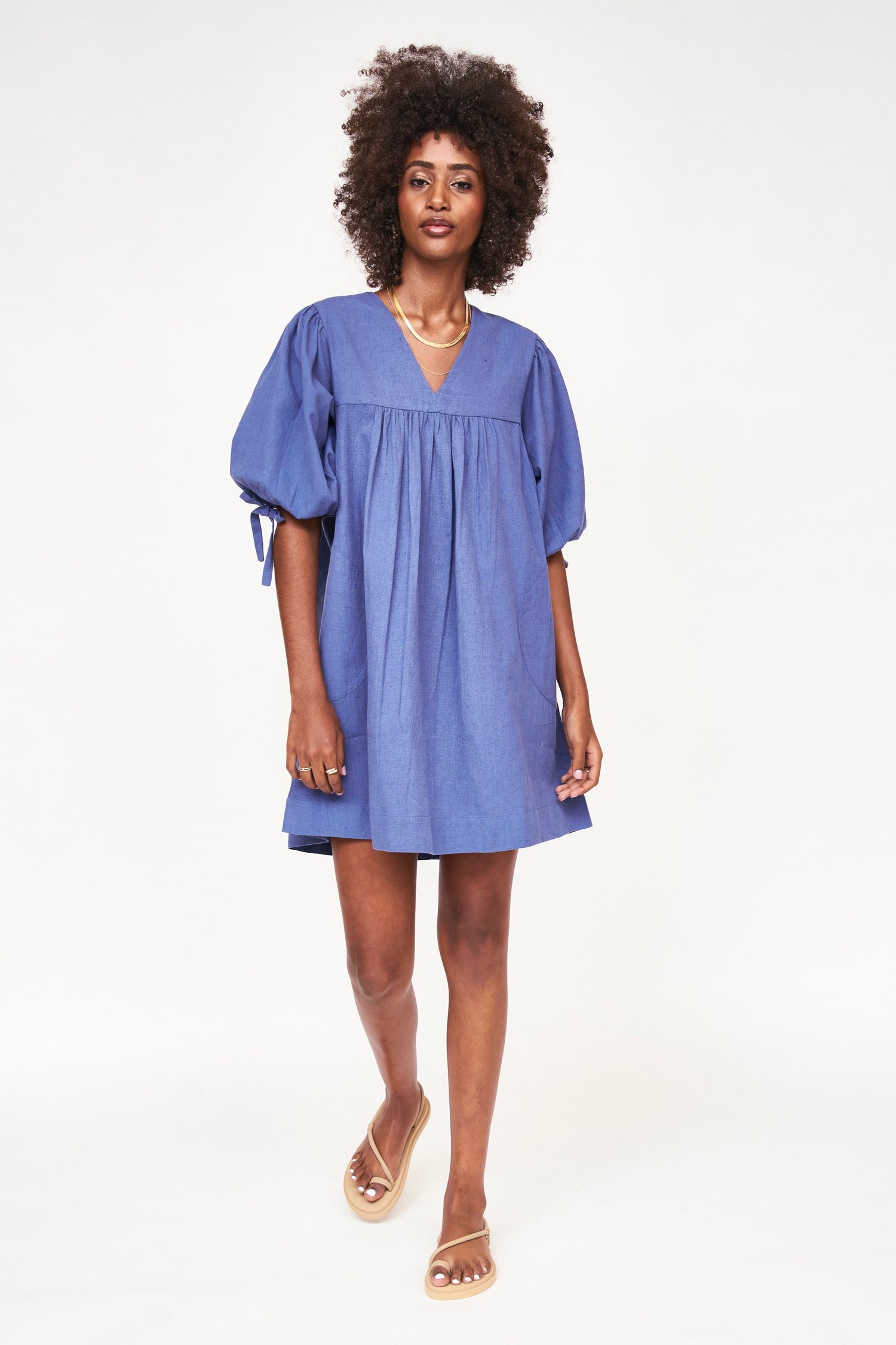 An easy, pullover style dress with a relaxed fit, made with 100% cotton that's hand loomed to give it a linen feel. Ethically made in India.