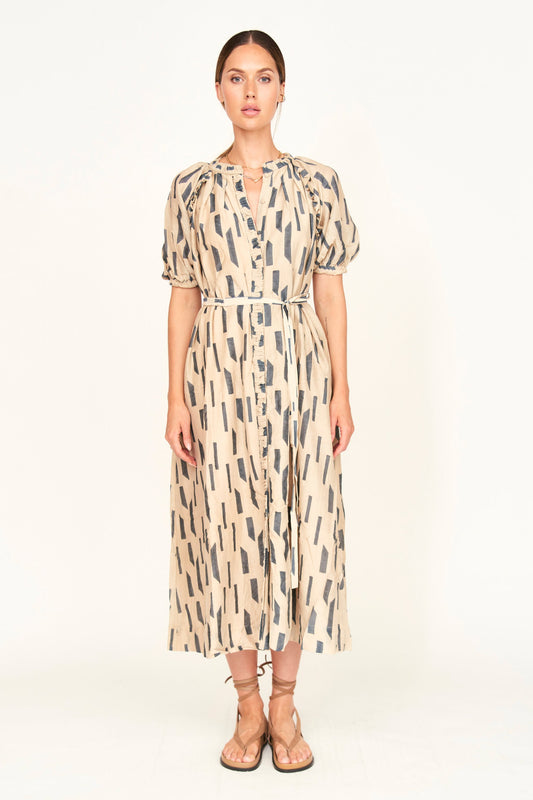 The Somerset Dress is a hand block printed, Midi length dress with high low hem, and raglan sleeves and ruffle detailing.