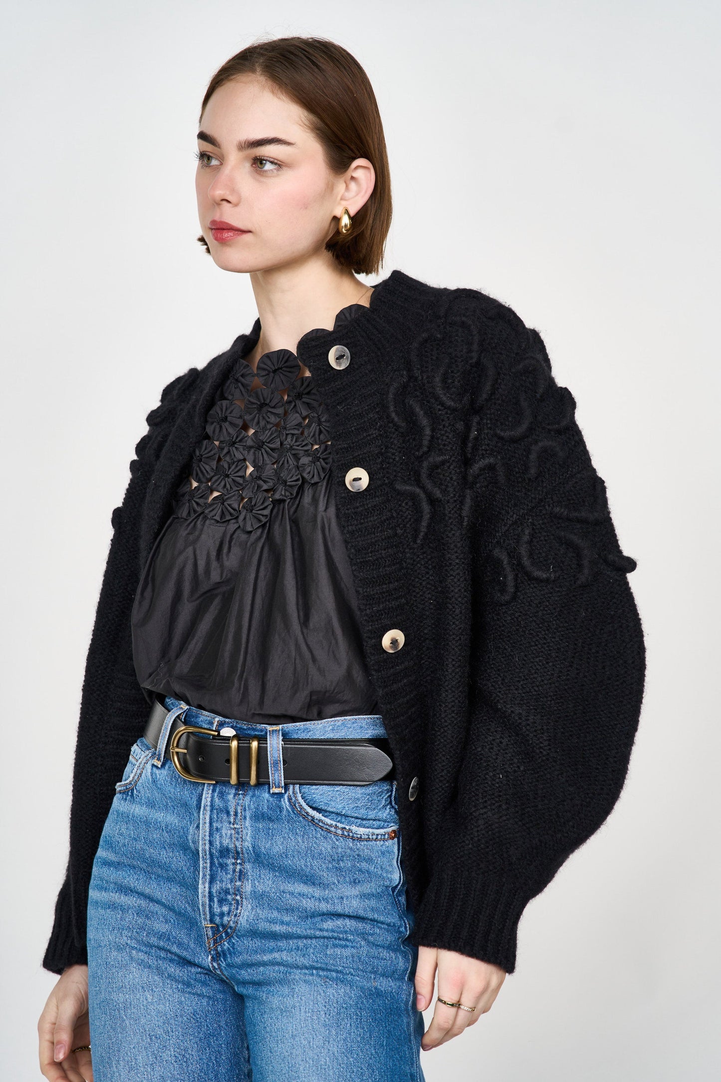Mirth Cusco Cardigan in Black - A cozy winter cardigan featuring hand embroidered detailing on the shoulders. Designed to layer, this is the one we think your closet needs most. Handmade in India.