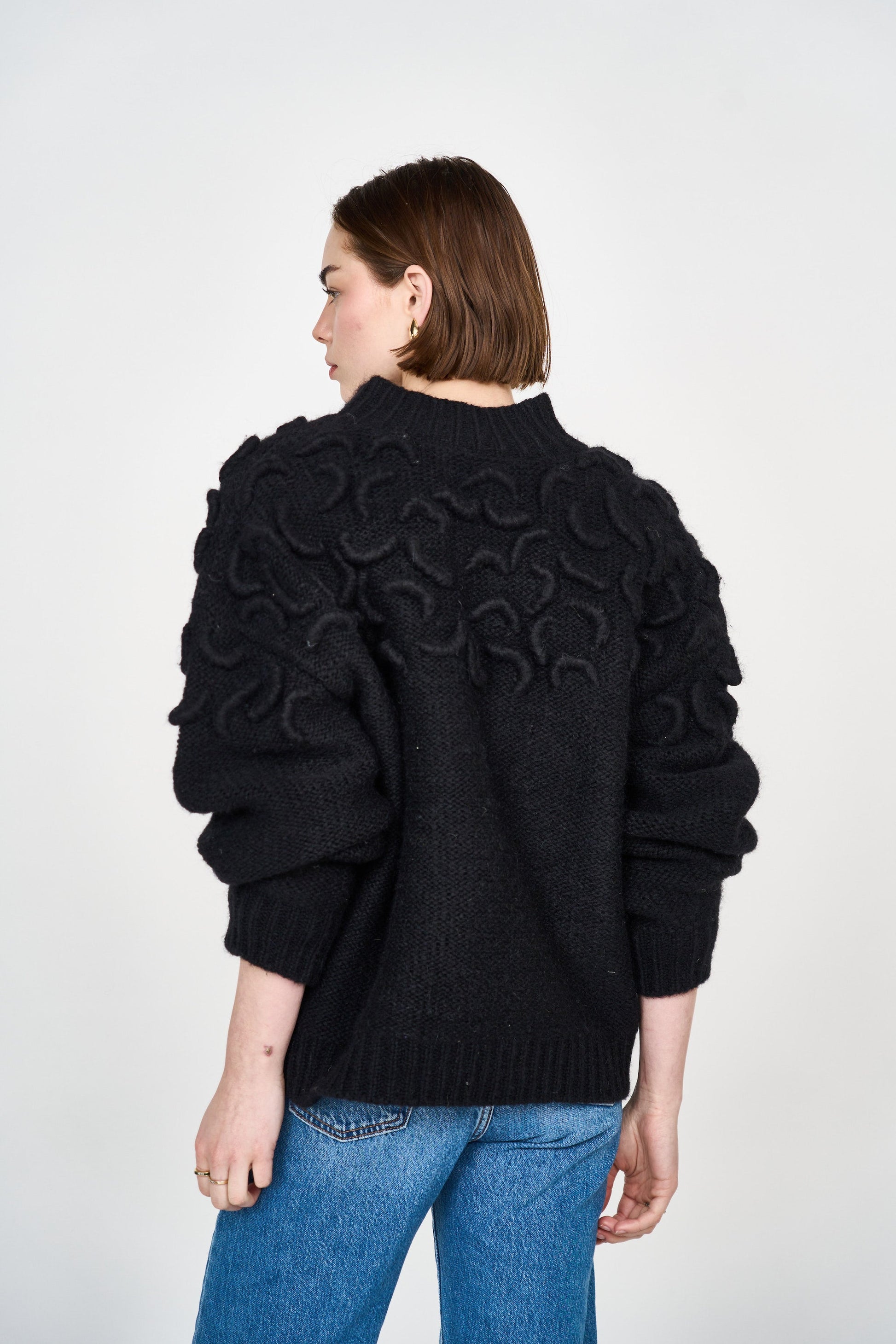 Mirth Cusco Cardigan in Black - A cozy winter cardigan featuring hand embroidered detailing on the shoulders. Designed to layer, this is the one we think your closet needs most. Handmade in India.