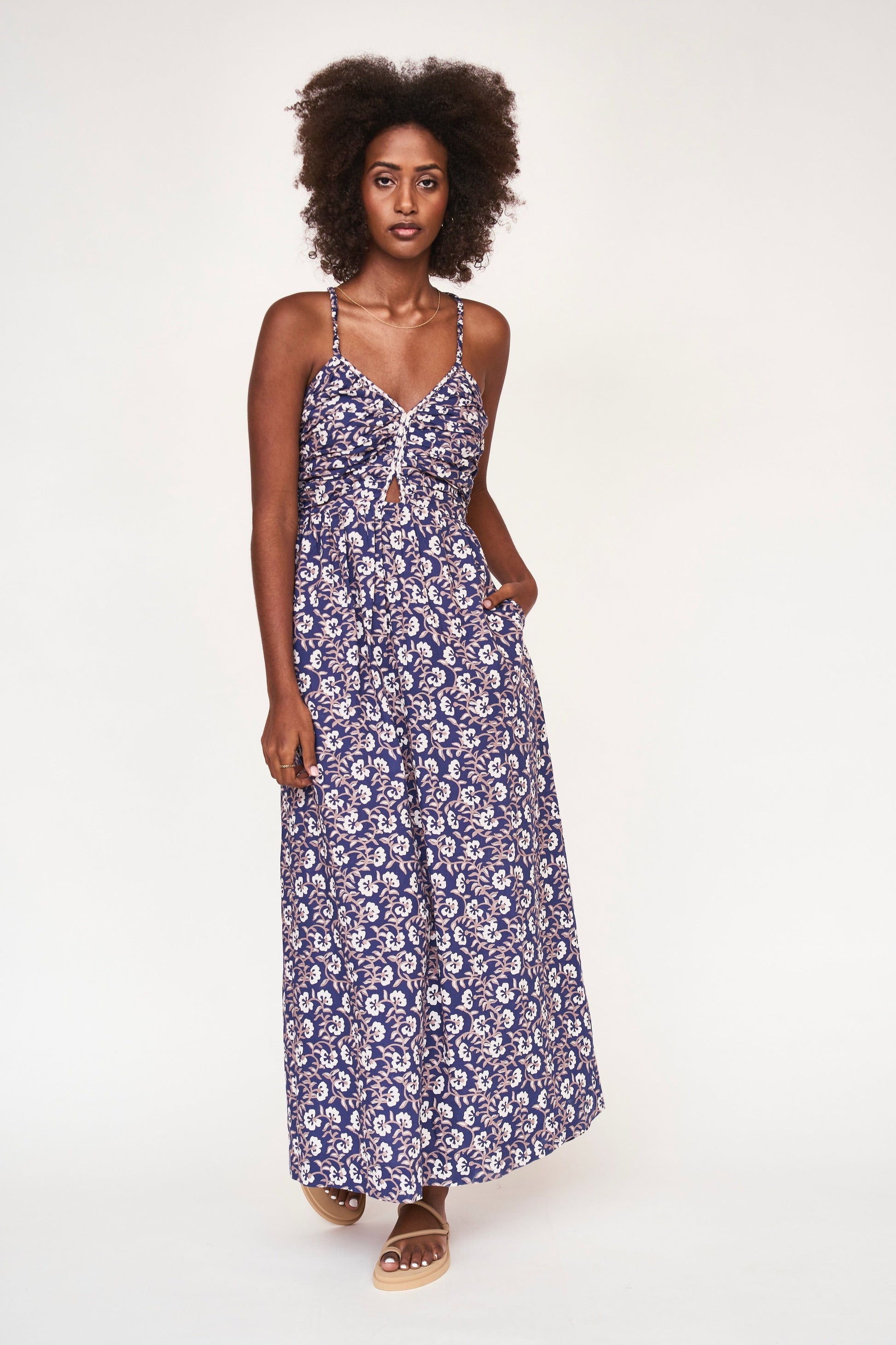 This effortless sundress transitions seamlessly from daytime to evening. Hand embroidered details along the front yoke make it extra special. Straps are elastic to ensure the perfect fit, as is the back bodice and waist. Ethically made with 100% cotton in India.