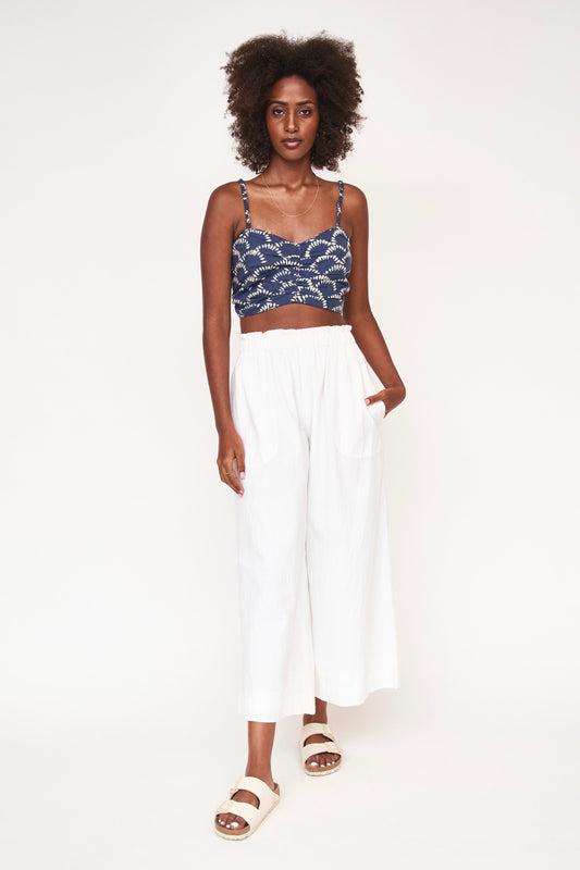 This paperbag waist pant is comfy, roomy, high waisted and wide legged. Wear it seaside with a swimsuit or with your favorite blouse tucked in. Ethically made in India.