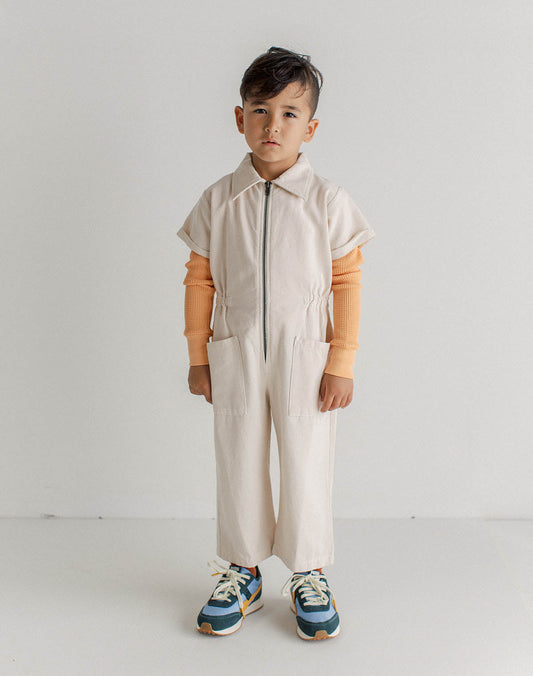 Noble's Utility Suit is durable enough to hold up to your child’s play, but also soft enough to be against their delicate skin all day. Made in Peru with GOTS certified organic Pima cotton canvas.