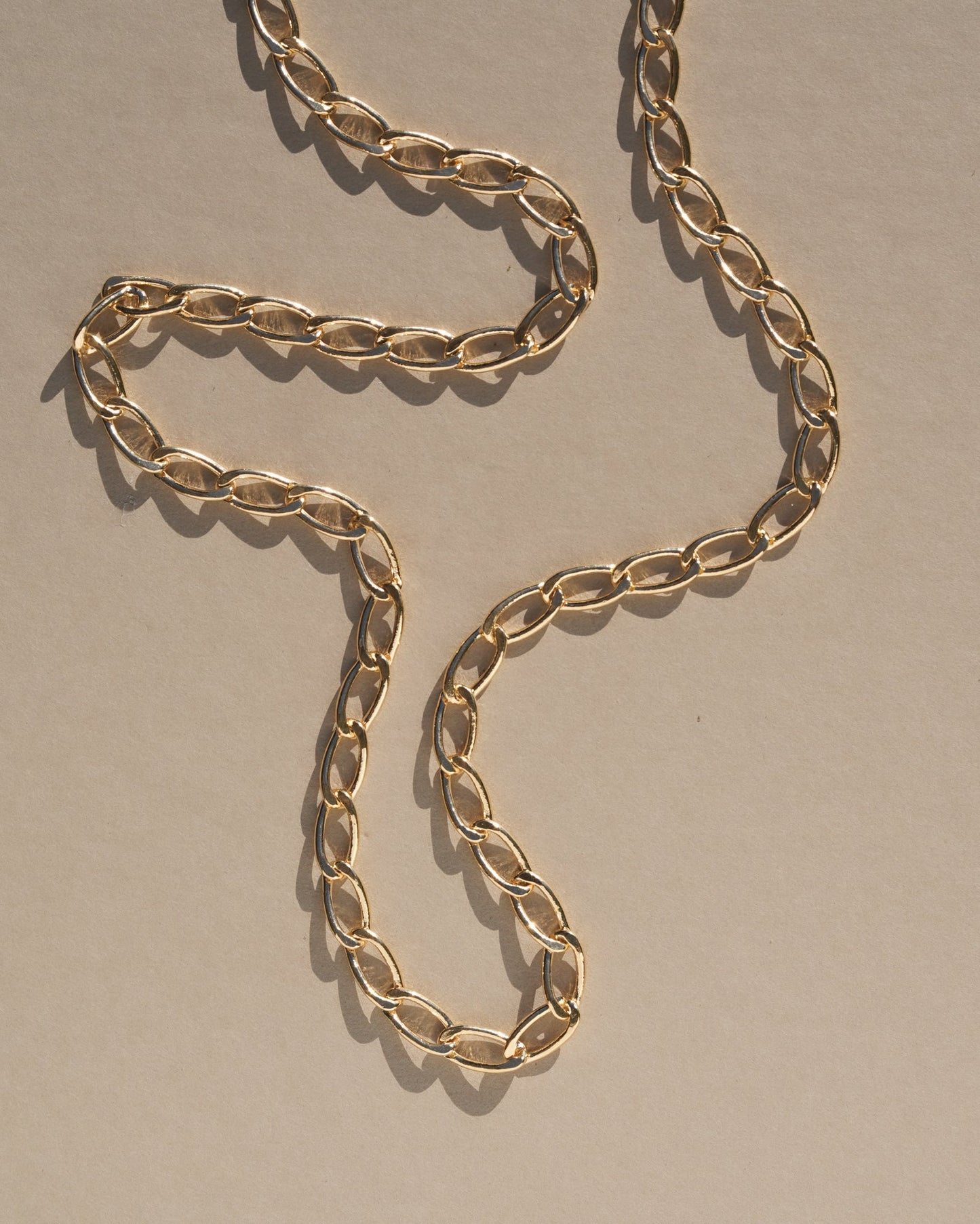 Reinterpreting a classic style with a bold modern twist, this chunky chain adds some extra style to the everyday. A sleek, minimal look that’s perfect for layering, handmade with gold oval rings.    Handmade in the Santa Cruz Mountains.