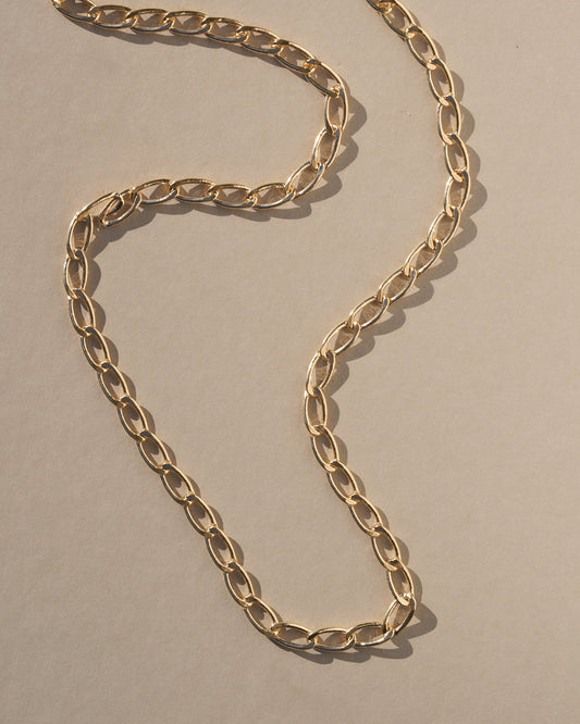 Reinterpreting a classic style with a bold modern twist, this chunky chain adds some extra style to the everyday. A sleek, minimal look that’s perfect for layering, handmade with gold oval rings.    Handmade in the Santa Cruz Mountains.