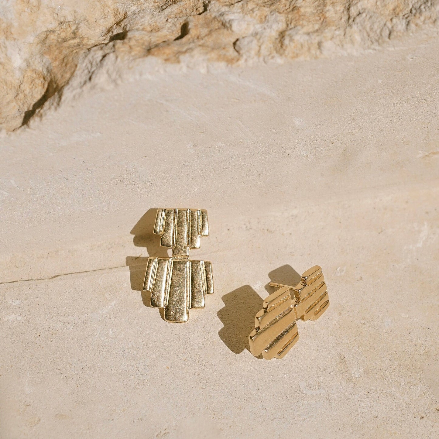 Sculptural structural hand carved stud earrings reminiscent of ancient empires, amulets and totems. Gold vermeil earrings handmade in the Santa Cruz Mountains.