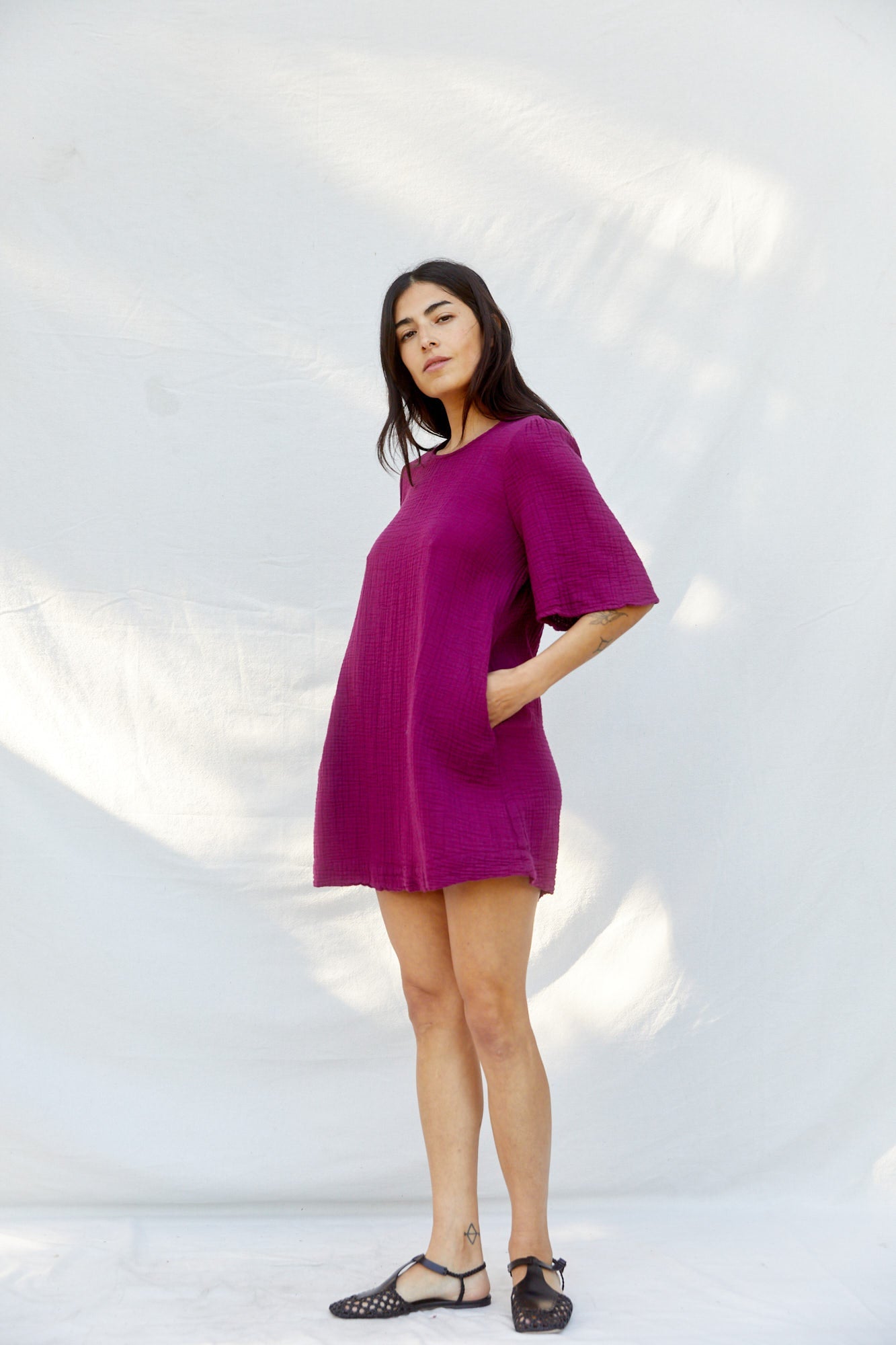 A mini dress that's not too mini. Subtle bell-shaped sleeves, slightly shirred at the shoulders for understated detail. Sustainably made  from 100% Organic Cotton with love in Los Angeles.
