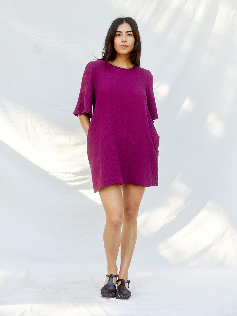 A mini dress that's not too mini. Subtle bell-shaped sleeves, slightly shirred at the shoulders for understated detail. Sustainably made  from 100% Organic Cotton with love in Los Angeles.