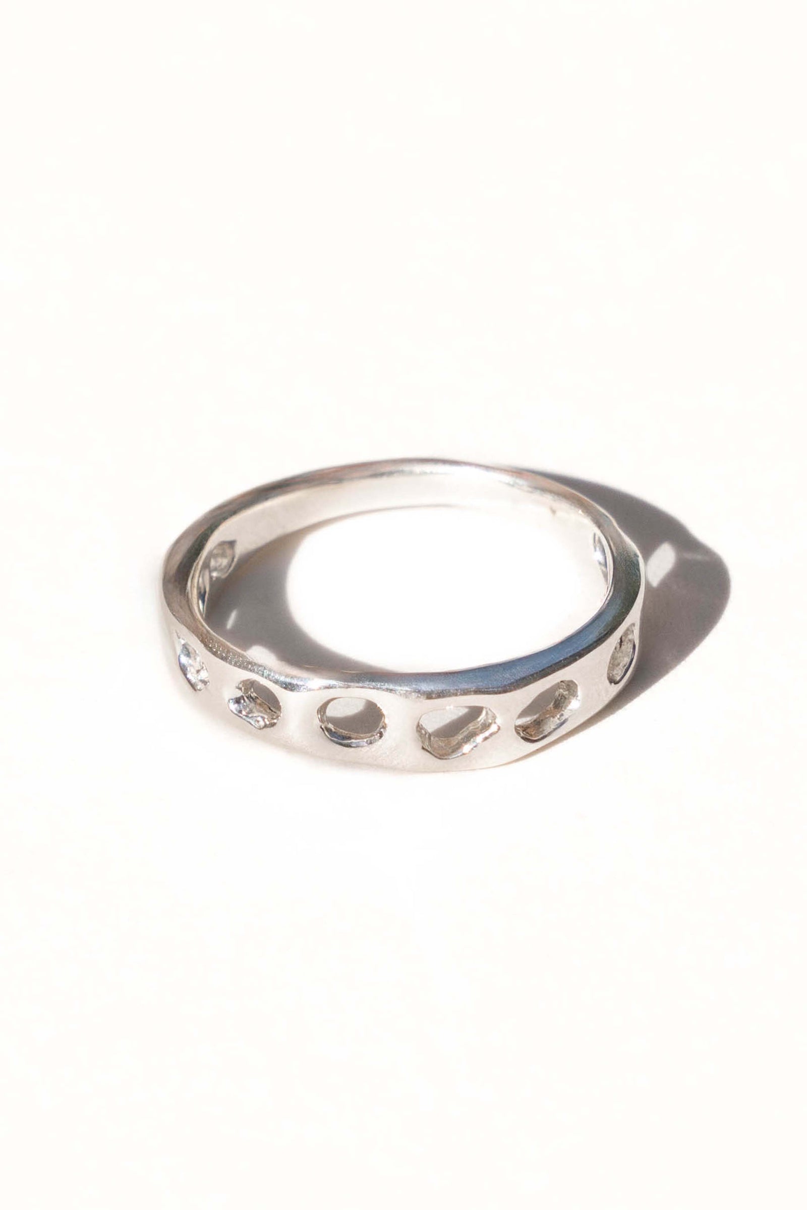 Handmade sterling silver ring on white background made by Moneh Brisel in Southern California
