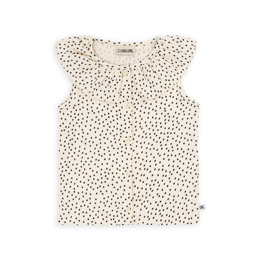 A sleeveless, button down blouse with a ruffled collar and B&W mini polka dot print. Ethically produced, colorful and fun with an eye towards comfort, style and joy. Modern and sustainable kids clothing by CarlijnQ of the Netherlands.