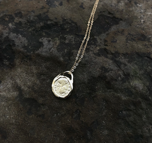 Reversible double sided coin charm necklace made using an ancient Roman coin, the Roma Necklace was designed to attract growth, fortune, and opportunity. Sterling silver cable chain.Handmade in the Santa Cruz Mountains.