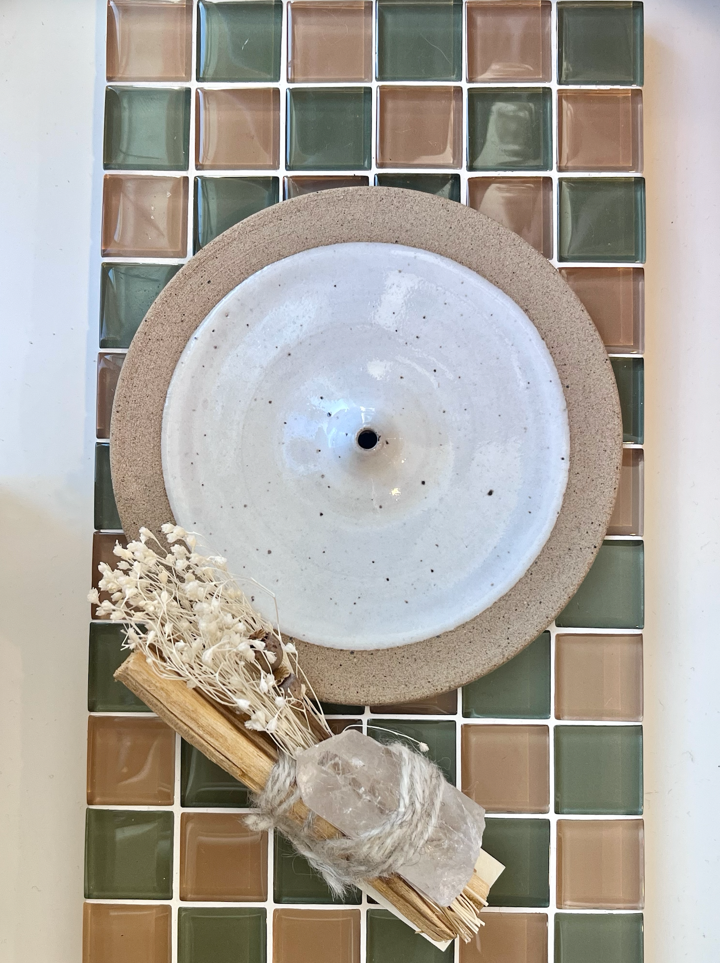 Handmade ceramic incense holder with a white speckled glaze. Each item is made individually in Olympia, Washington and there will be slight variation in each one.