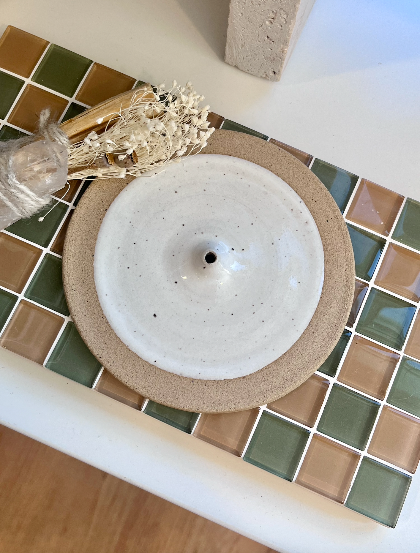 Handmade ceramic incense holder with a white speckled glaze. Each item is made individually in Olympia, Washington and there will be slight variation in each one.