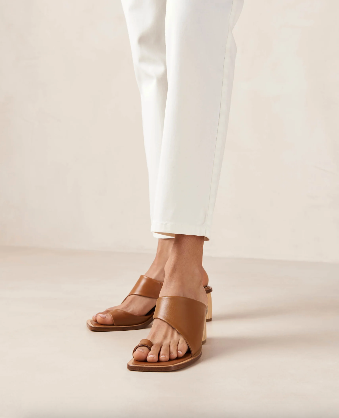With only a toe ring and front strap, the Josie sandals slip on with ease like a mule. Crafted from brown leather, they have wood-style block heels as well as padded insoles for cushioning and comfort.  Sustainably made in Portugal, designed in Barcelona.