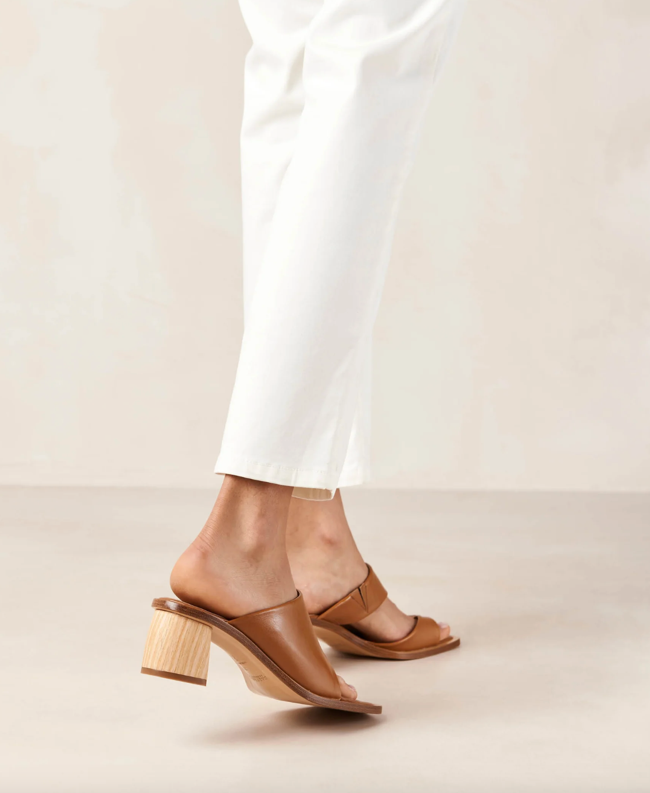 With only a toe ring and front strap, the Josie sandals slip on with ease like a mule. Crafted from brown leather, they have wood-style block heels as well as padded insoles for cushioning and comfort.  Sustainably made in Portugal, designed in Barcelona.