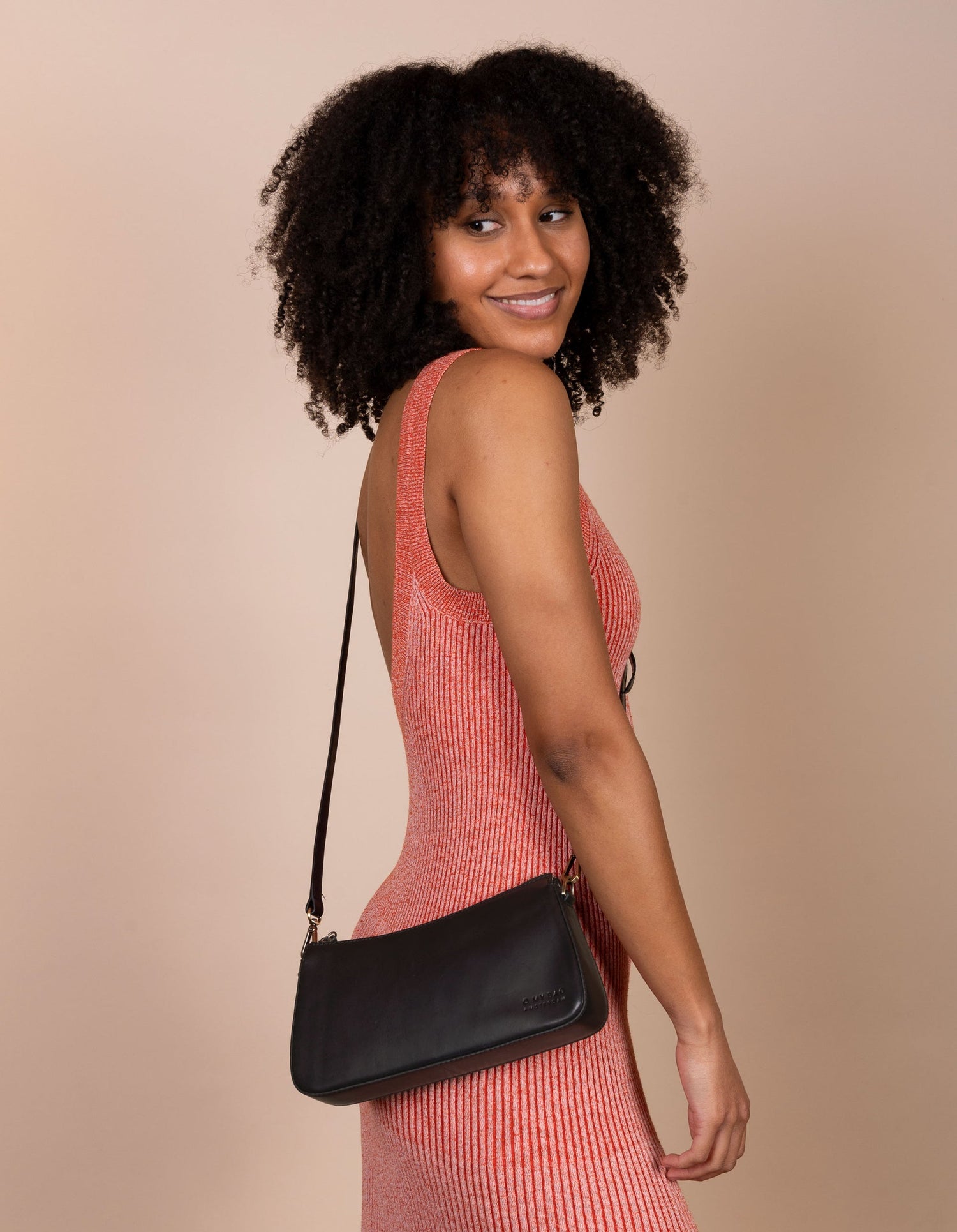 A bag that gives you an irreplaceable look and feel of a fun night out? Here she is! Small but mighty, Taylor has a compact and convenient design optimized to fit your most important belongings. She comes with one short strap and one long adjustable strap for a crossbody look. Made in India.
