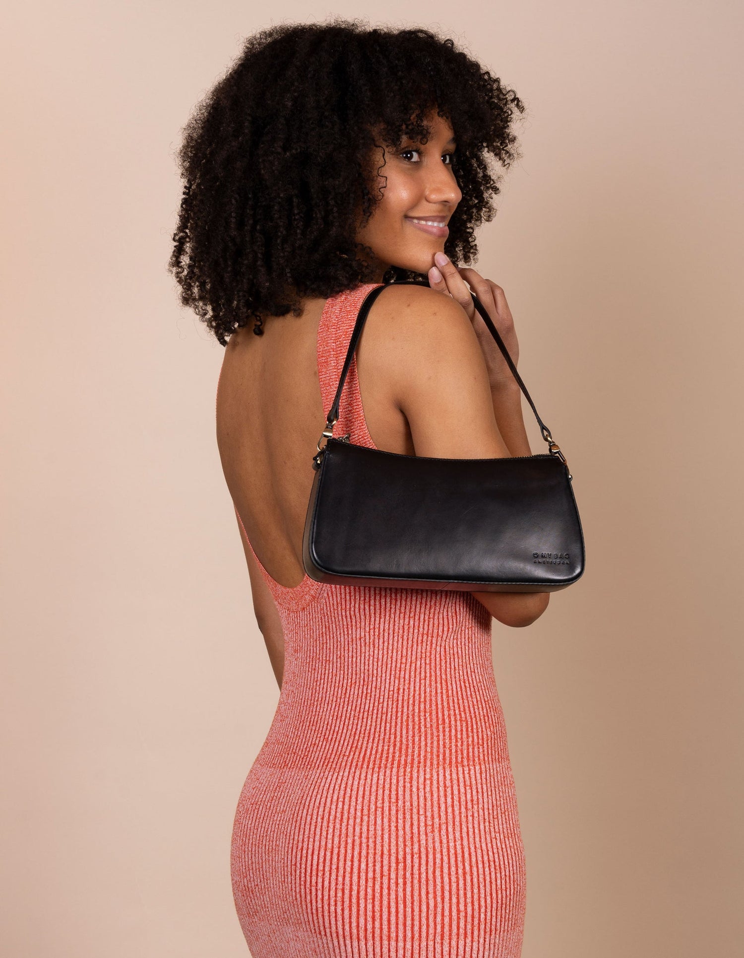 A bag that gives you an irreplaceable look and feel of a fun night out? Here she is! Small but mighty, Taylor has a compact and convenient design optimized to fit your most important belongings. She comes with one short strap and one long adjustable strap for a crossbody look. Made in India.