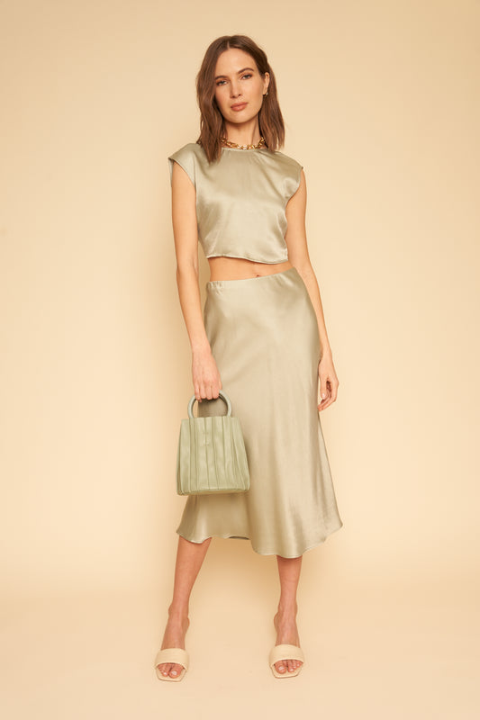Donna is the cutest sage green silky slip skirt that features an elastic waist so it's even more perfect and comfy. Cut on the bias, this skirt guarantees to hug you in all the right places. Pair with the Valentina Silk Top to really be a show stopper. Ethically made in LA.