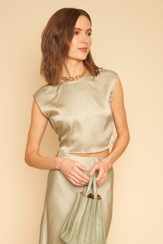 The Valentina wrap top in a silky sage can be worn wrapped or tied in front or back. Made in Los Angeles.