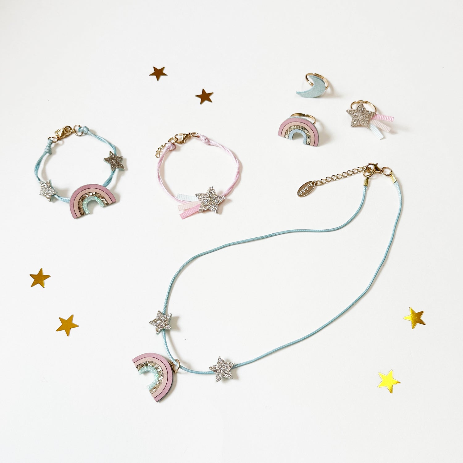 magical shimmer rainbow bracelet set rockahula / Shimmer and shine with this gorgeous set of two beautifully detailed bracelets. Featuring one bracelet with our pretty pastel rainbow and the other with a glittering shooting star! Both are set onto soft pastel coloured cord with a lobster clasp fastening and extender chain to ensure a good fit.