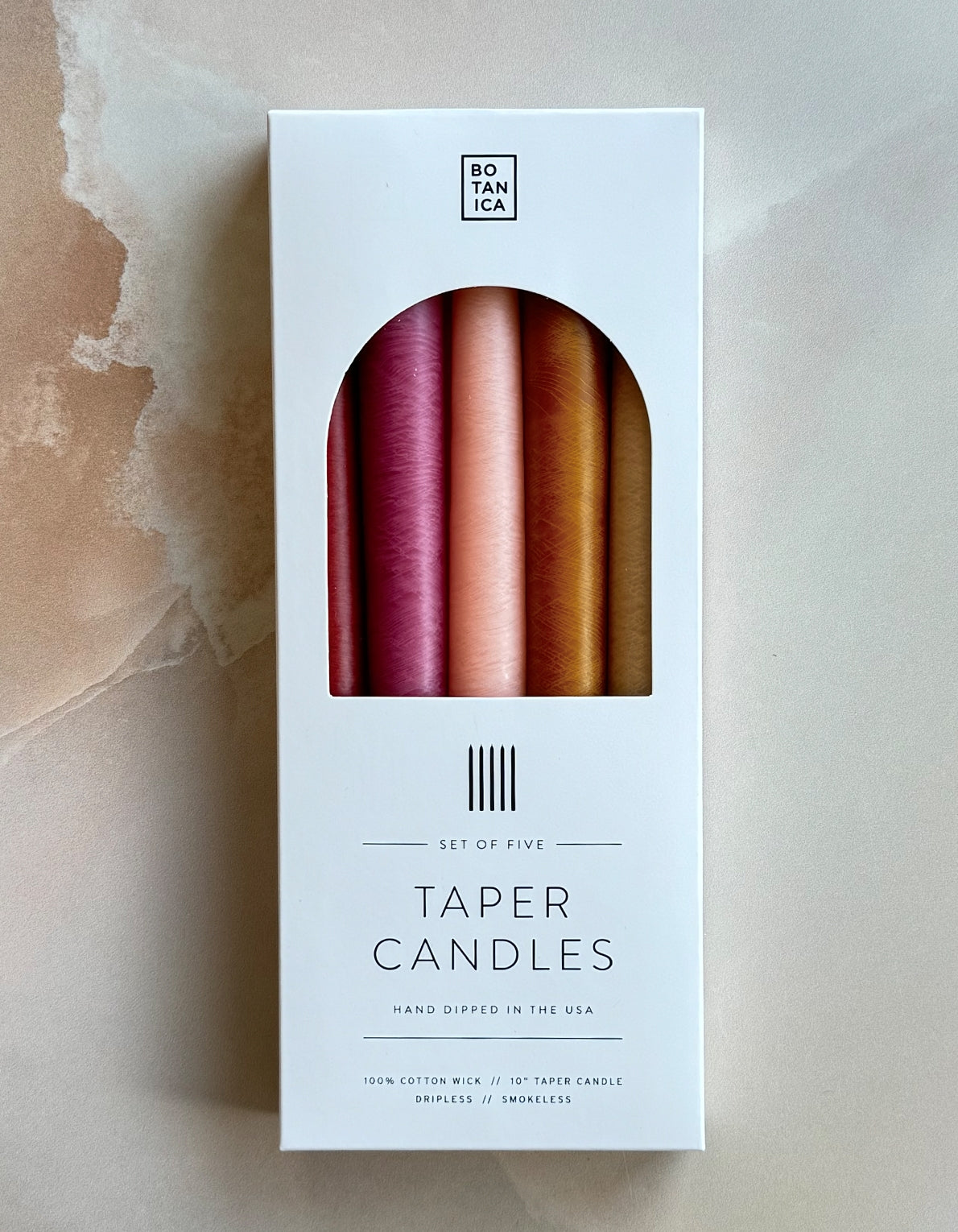Botanica's set of five tapered candles are dipped over 20 times by hand, creating the ideal taper–dripless and smokeless–perfect for dinner parties and creating warm, homey ambiance. 