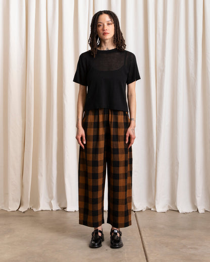 ali golden / An elastic waist pant in raw silk with poppy/pink plaid pattern and barrel pant silhouette.