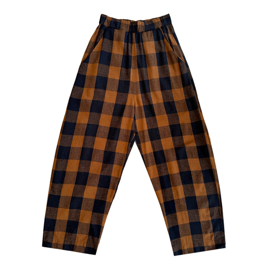 ali golden / An elastic waist pant in raw silk with poppy/pink plaid pattern and barrel pant silhouette.