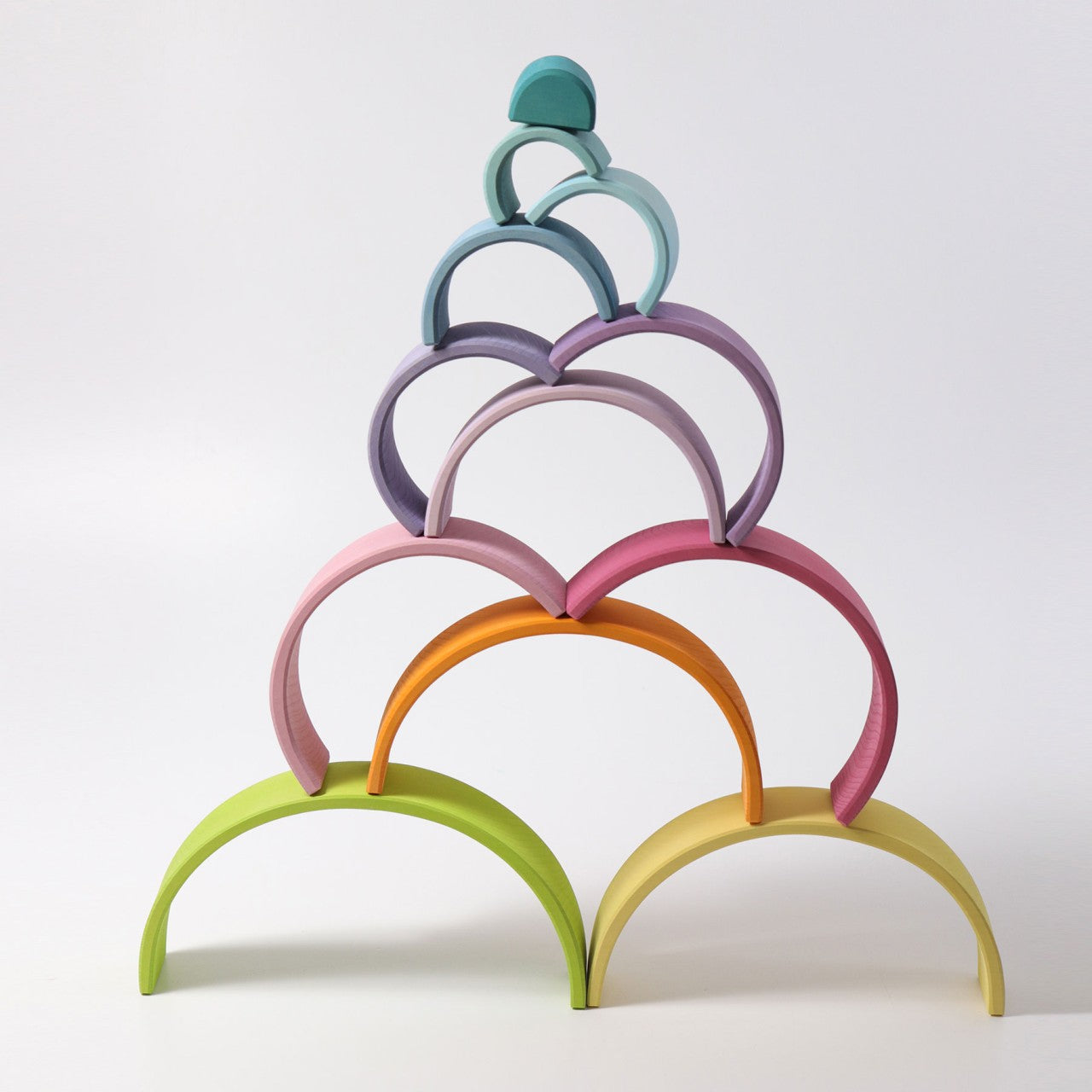 Large wooden rainbow toy by Grimms.