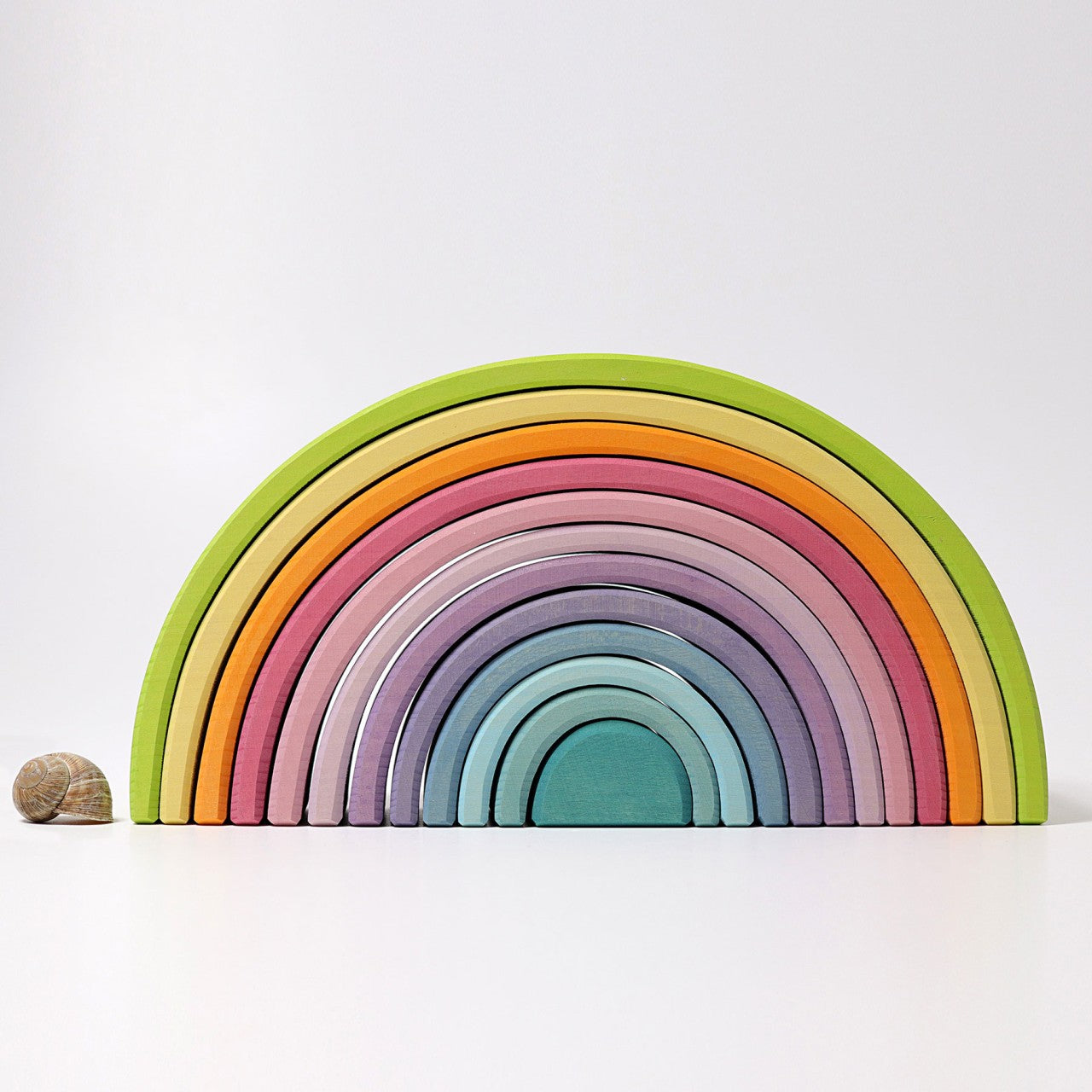 Large wooden rainbow by Grimms toys sustainably made.