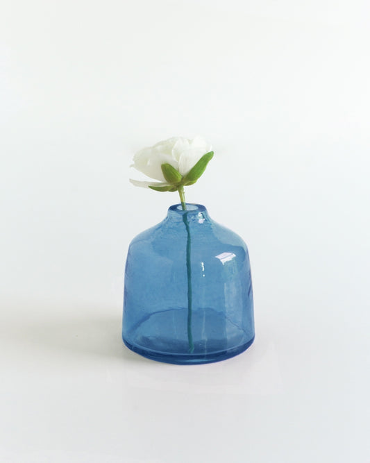 bella hammered glass bud vase . Ideal for showcasing a single bloom or a small bouquet, these bud vases bring a touch of subtle texture to any space while honoring a commitment to people and the planet.