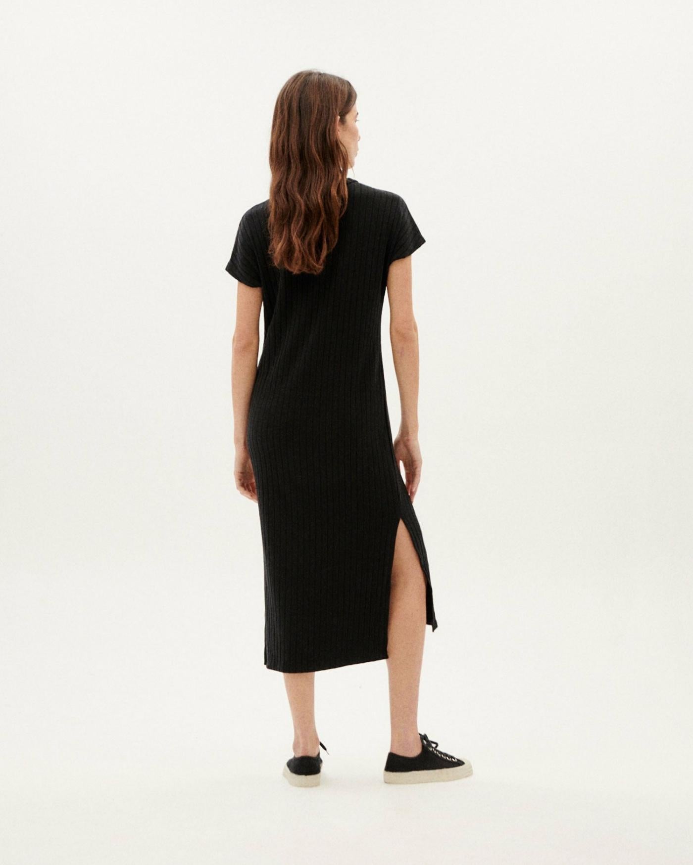 Thinking Mu Black Trash Cherry dress. Ribbed midi-length dress with a straight cut, round neck and short draped sleeves and side slits at the hem. Ethically made in India.