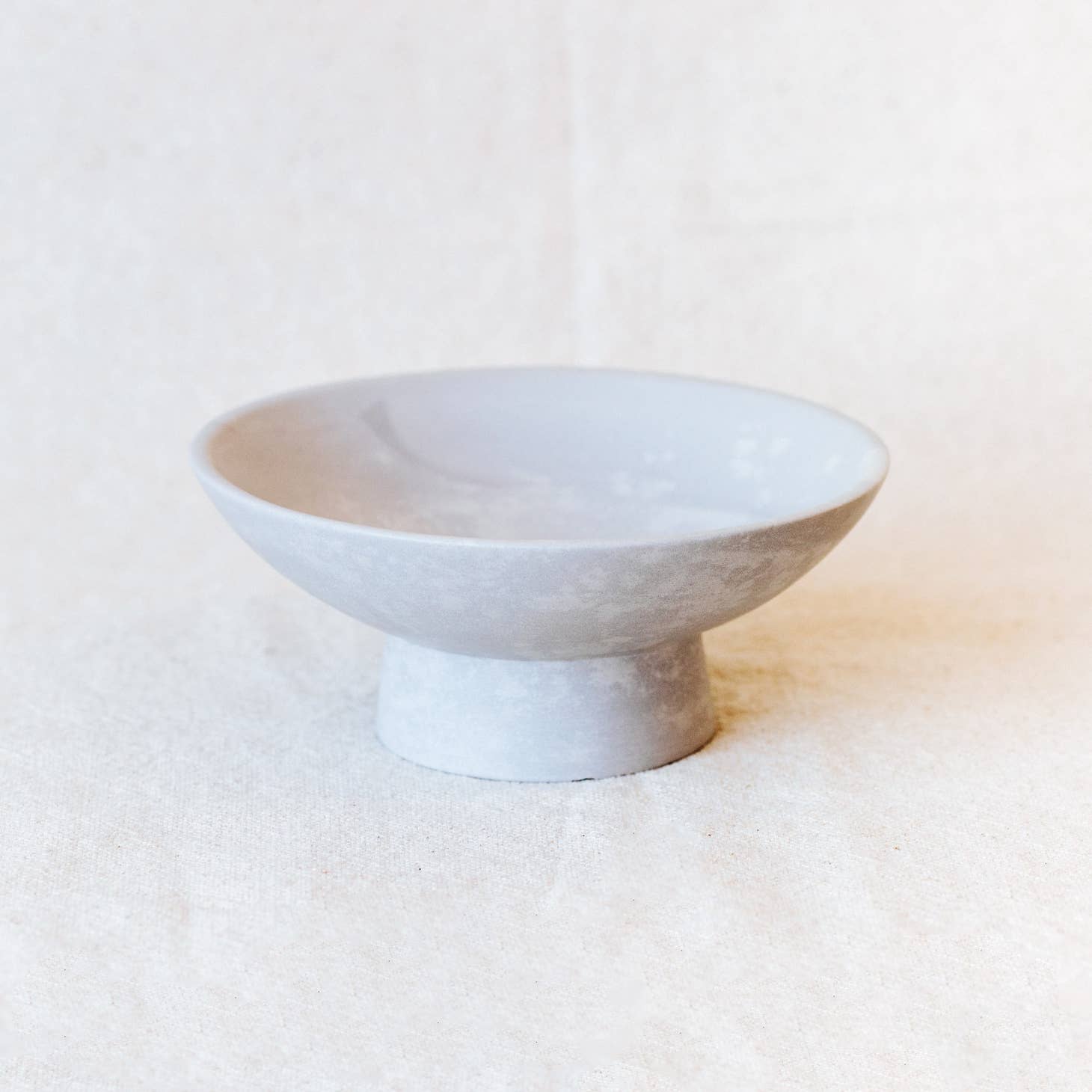 This bowl features a pedestal to boast your centerpieces & valuables.  Hand-carved from soapstone in western Kenya.