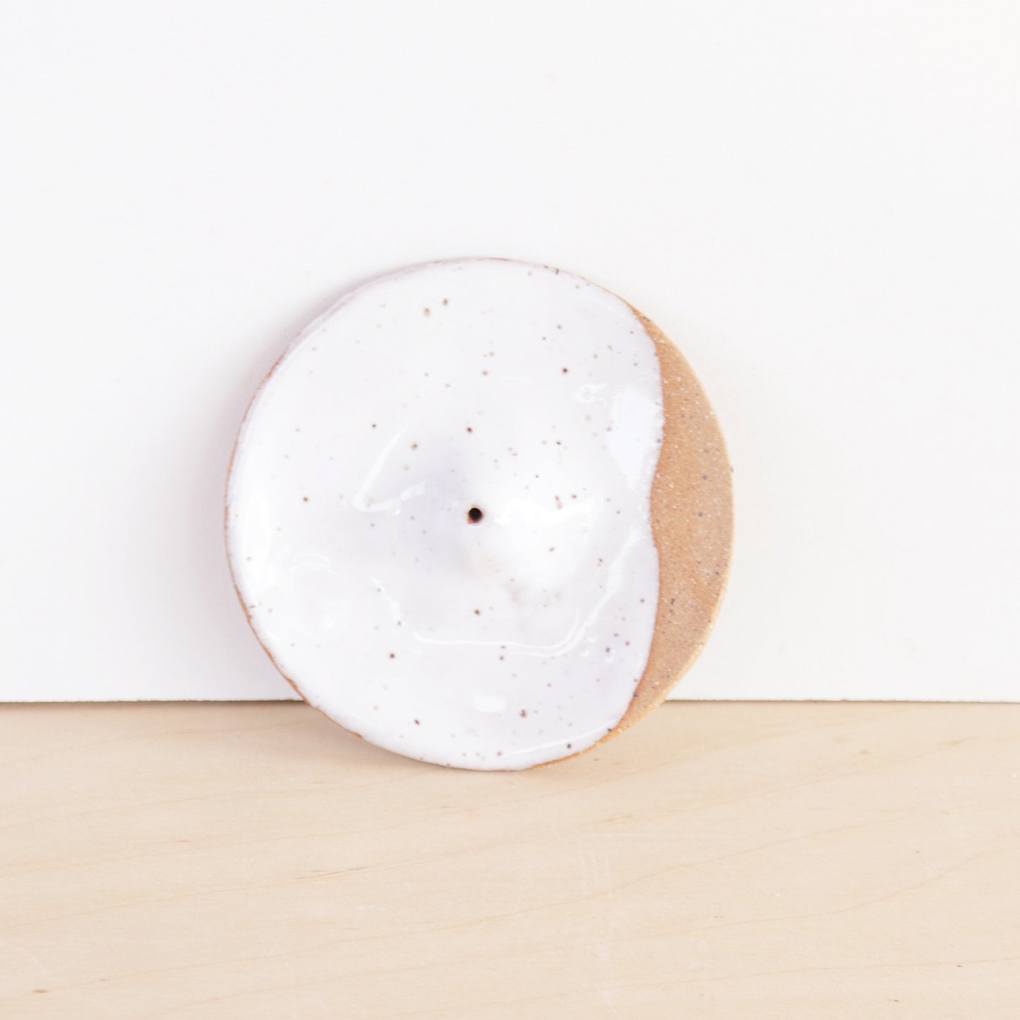 Modern, minimalist incense holder. Made of a speckled stoneware clay, finished with white or lavender glaze. 