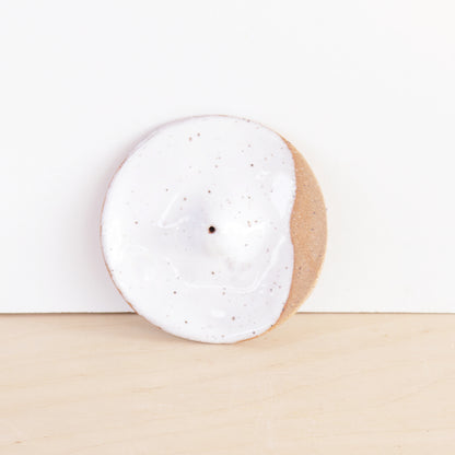Modern, minimalist incense holder. Made of a speckled stoneware clay, finished with white or lavender glaze. 